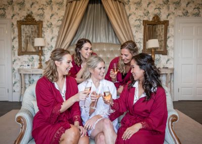 Bride and her bridesmaids getting ready at Goodnestone Park